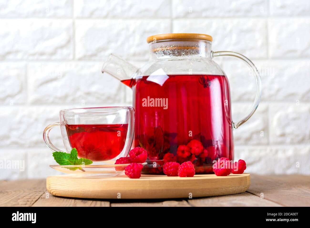 Herbal tea with berries, raspberries, mint leaves and hibiscus flowers ...
