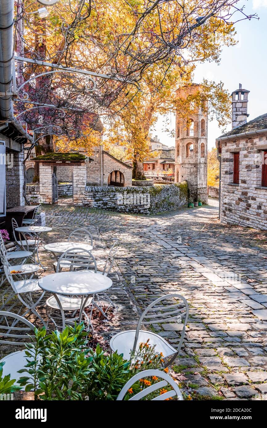 Traditional architecture  in a stone street during  fall season in the picturesque village of papigo in Epirus zagori greece Stock Photo