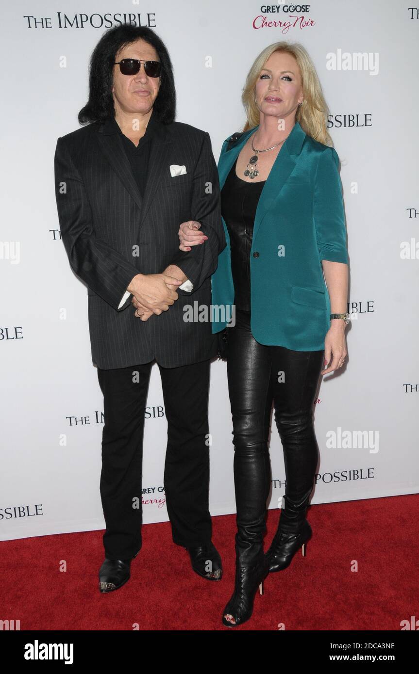 GENE SIMMONS and wife Shannon at The Impossible Premiere at the ...