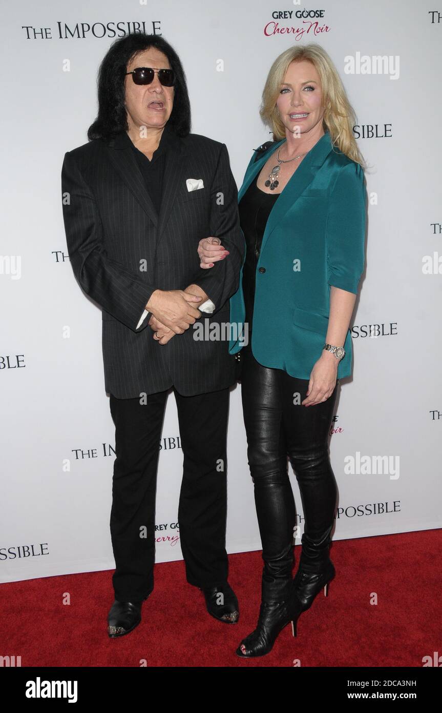 GENE SIMMONS and wife Shannon at The Impossible Premiere at the ...