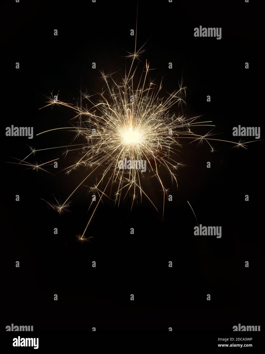 Glittering burning sparkler on black background Stock Photo