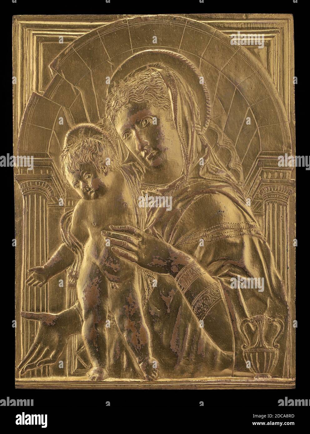 Anonymous Artist, (sculptor), Donatello, (related artist), Florentine, c. 1386 - 1466, Madonna and Child within an Arch, mid 15th century, gilded bronze, overall: 20.35 x 15.31 cm (8 x 6 in.), gross weight: 1334.8 gr (2.943 lb Stock Photo
