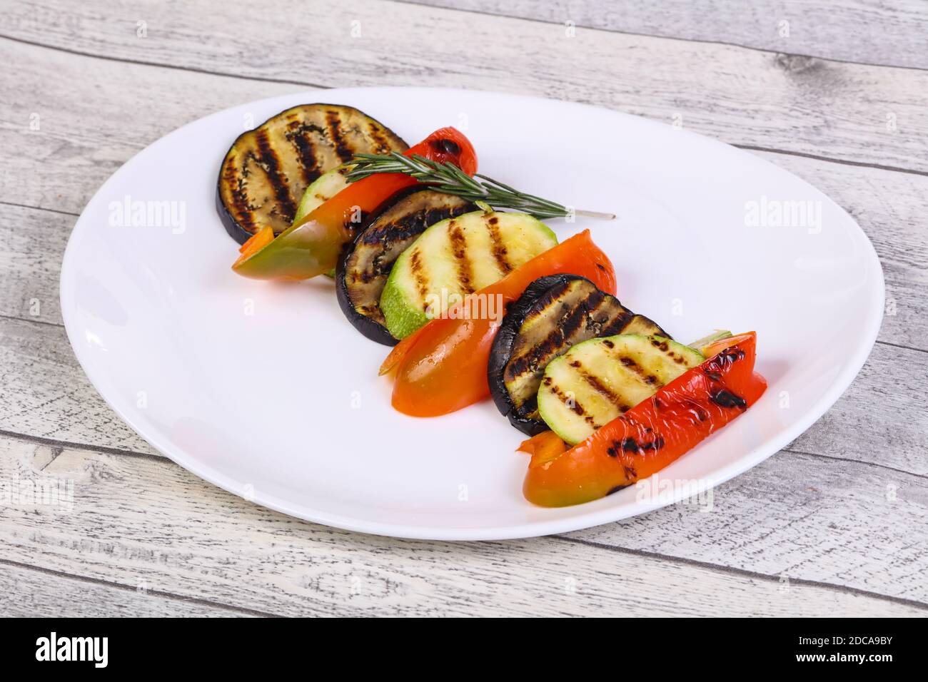 Grilled vegetables eggplant, zucchini and pepper in the plate Stock