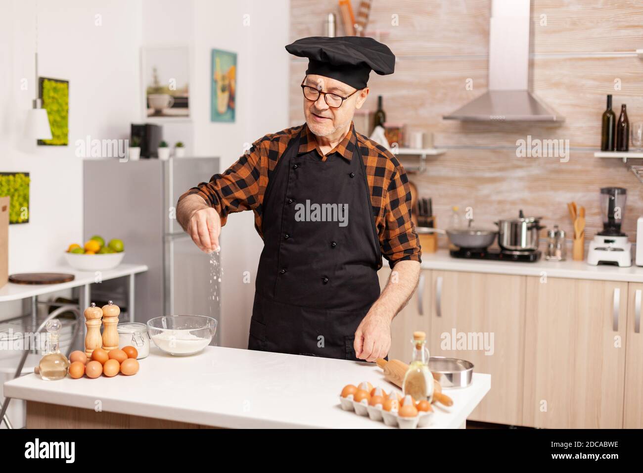 Smiling Kids In Cook's Uniform Making Bakery Dough With Flour And Eggs In  The Kitchen Stock Photo, Picture and Royalty Free Image. Image 60681329.