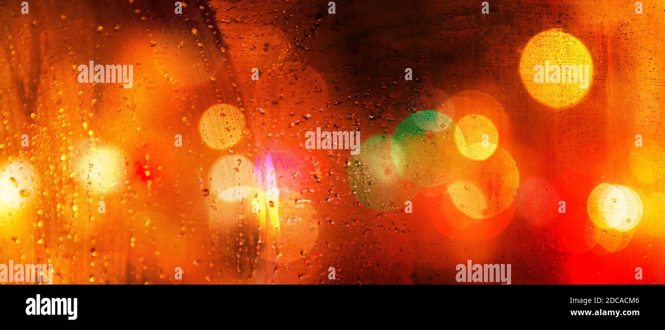 Banner of colorful city lights blurred with bokeh effect on a rainy day ...