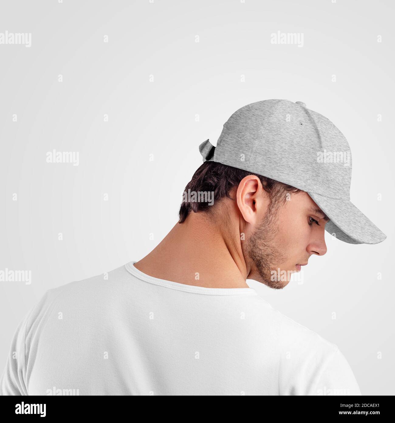 Mockup gray baseball cap heather on the head of a man, sports panama with a visor, isolated on background, back view, side. Template for branded headd Stock Photo