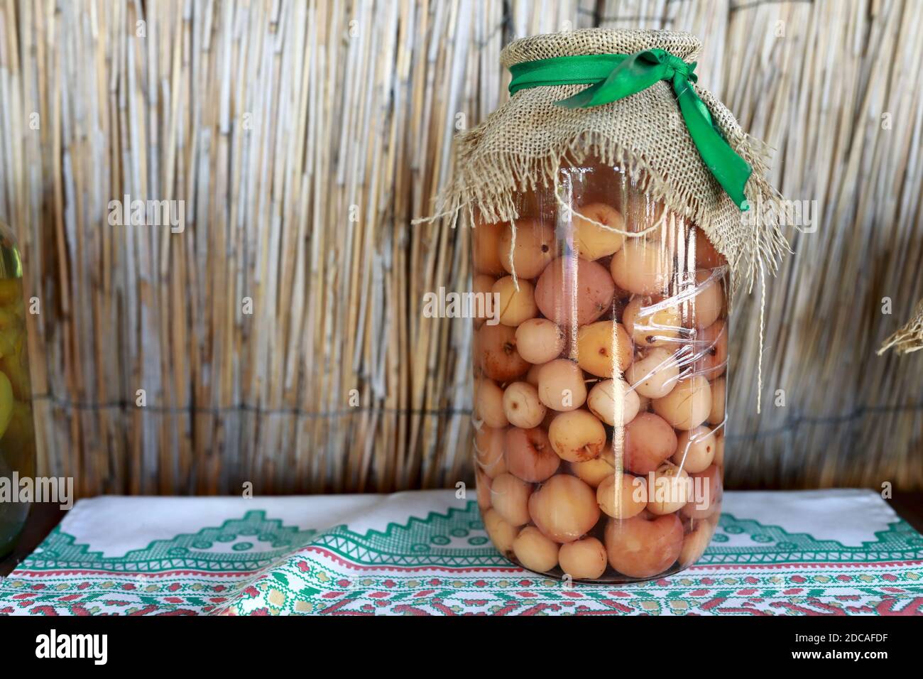 Apple compote in glass jar on table Stock Photo