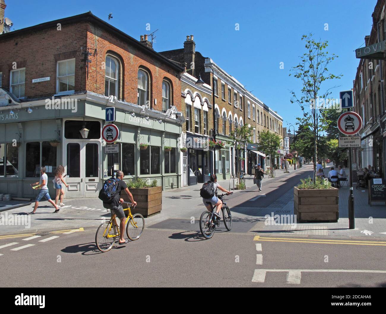 Cyclists on Orford Road, Walthamstow,London, UK. Newly pedestrianised shopping street, part of Waltham Forest's Mini-Holland scheme for safer streets. Stock Photo