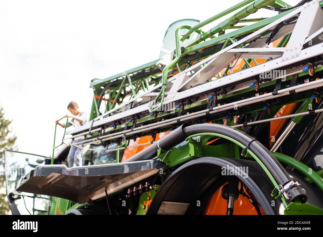 Part of agriculture machine close up with hydraulic system, steel tubes