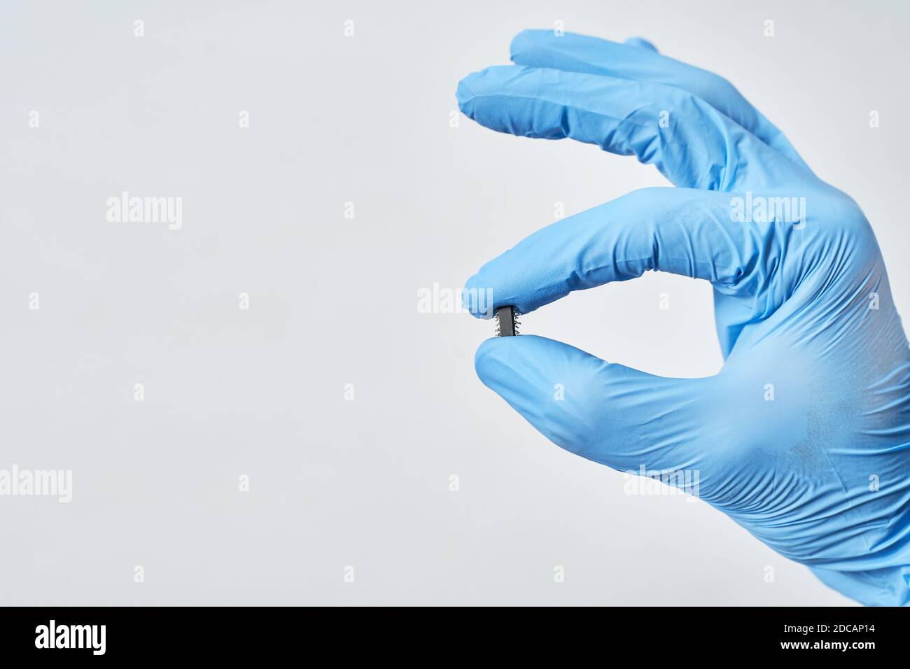 Embedding the chip under human skin, microcontroller implanting NFC technology. Stock Photo