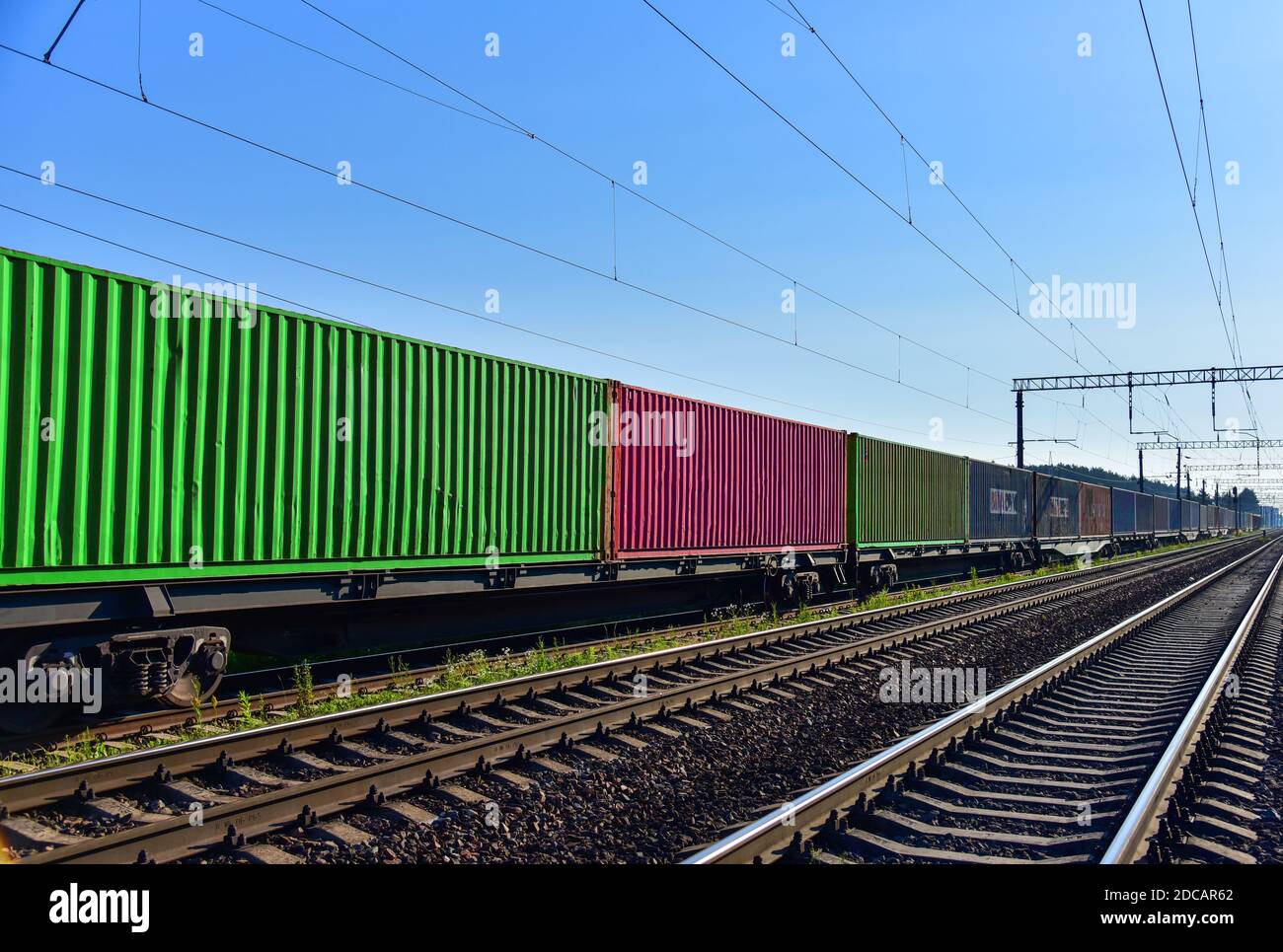 Cargo Containers Transportation On Freight Train By Railway. Intermodal ...