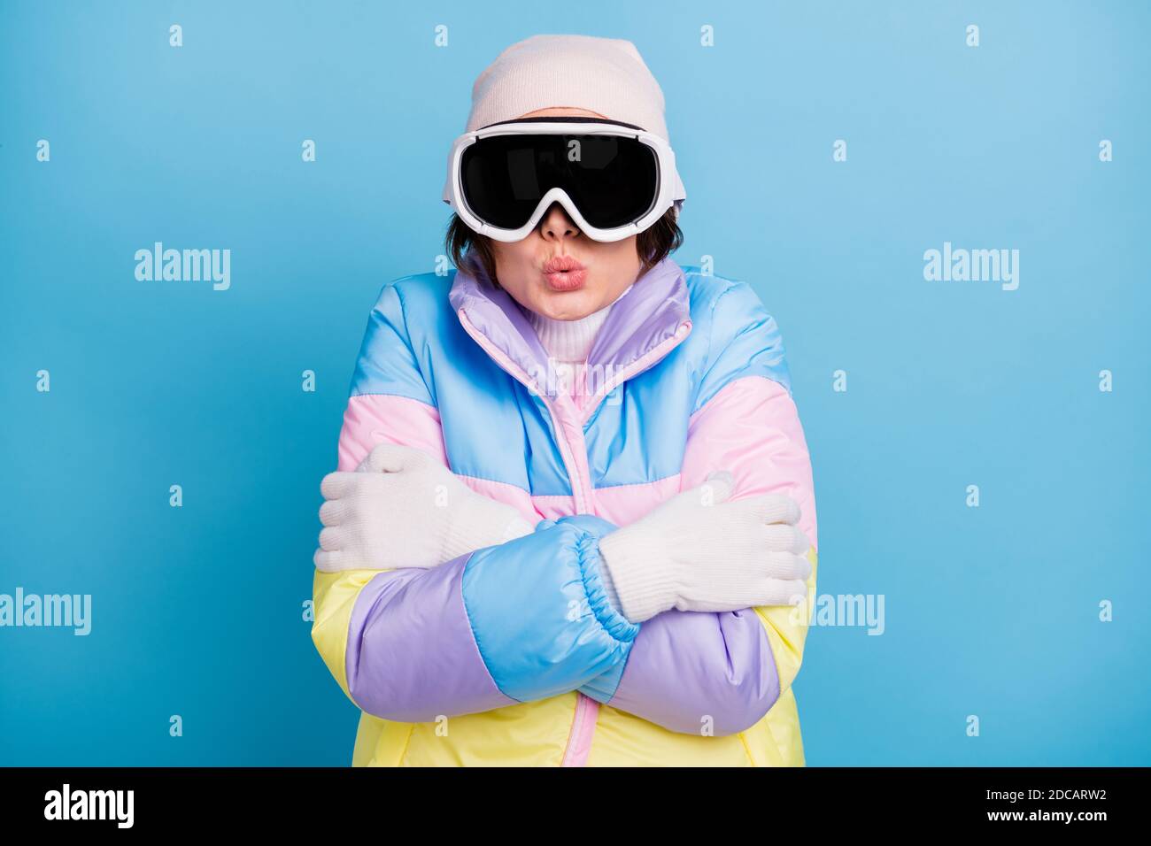 Woman Cold Mask Photo of freezing young woman hug herself cold wear hat mask winter ...