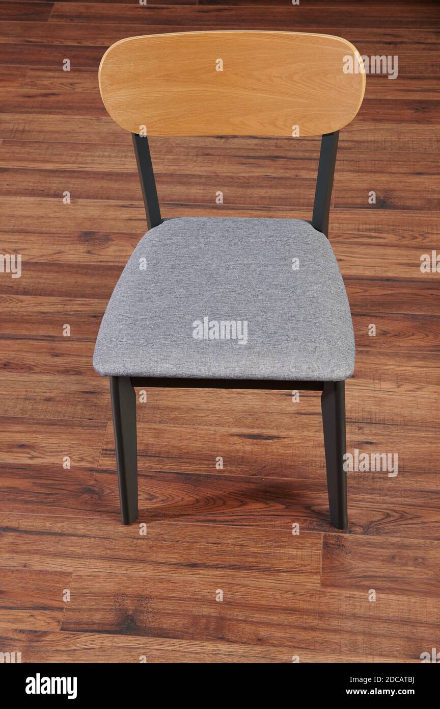 Grey color kitchen chair stay on wooden floor Stock Photo