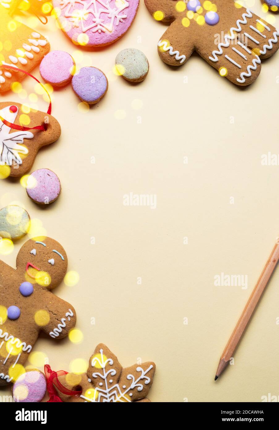 Empty Santa letter with Christmas traditional ginger cookies around it on wooden background. Christmas or New Year holiday background. Top view. Stock Photo