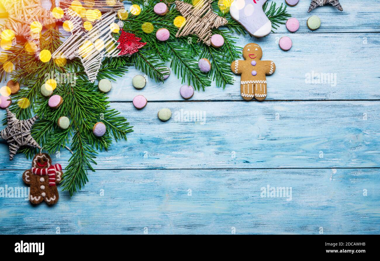 Blue wooden background with christmas decoration. Christmas or New Year holiday background. Top view. Stock Photo