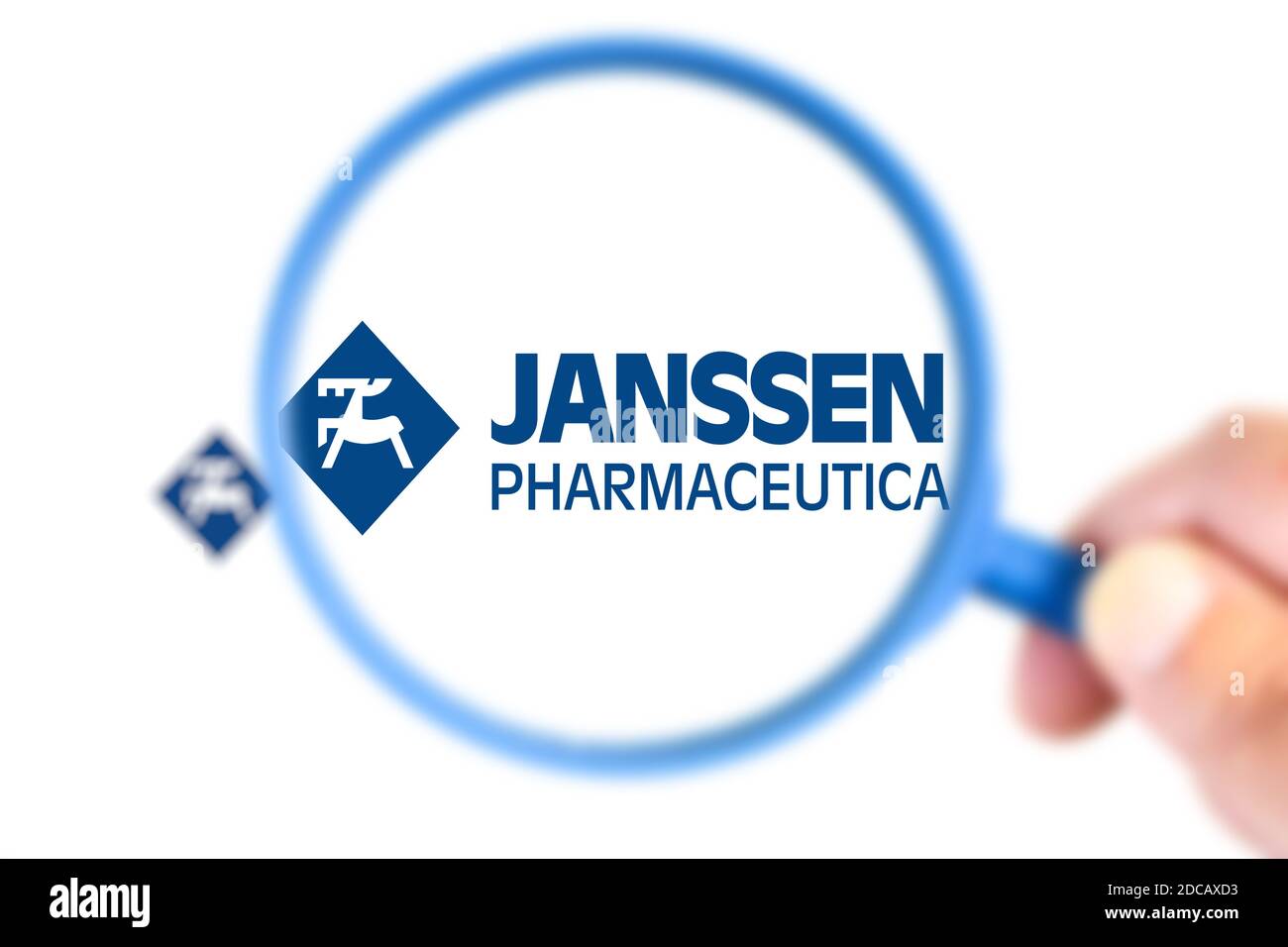 Benon, France - November 20, 2020:Janssen Pharmaceutica research laboratory logotype enlarged with a magnifying glass.This laboratory has developed a Stock Photo