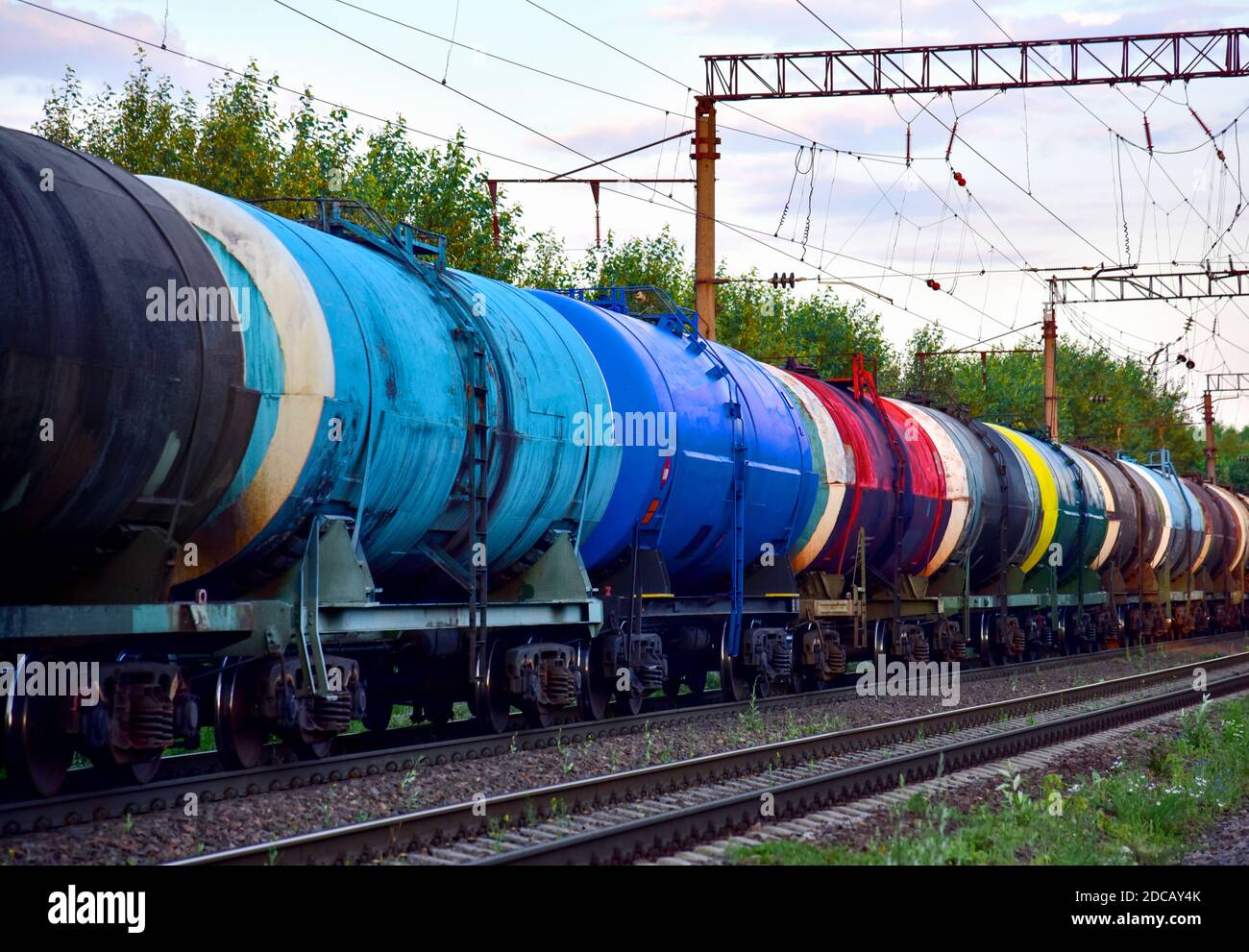 Freight train with petroleum tank cars on railroad. Rail cars carry oil