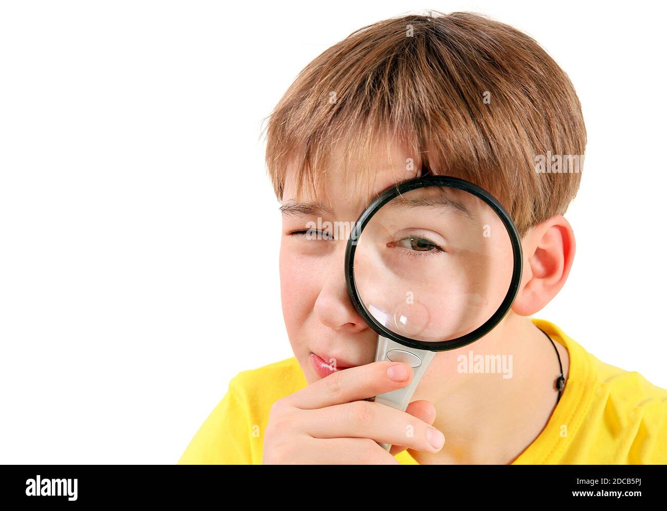 Curious Kid with Magnifying Glass Isolated on the White Background Stock Photo