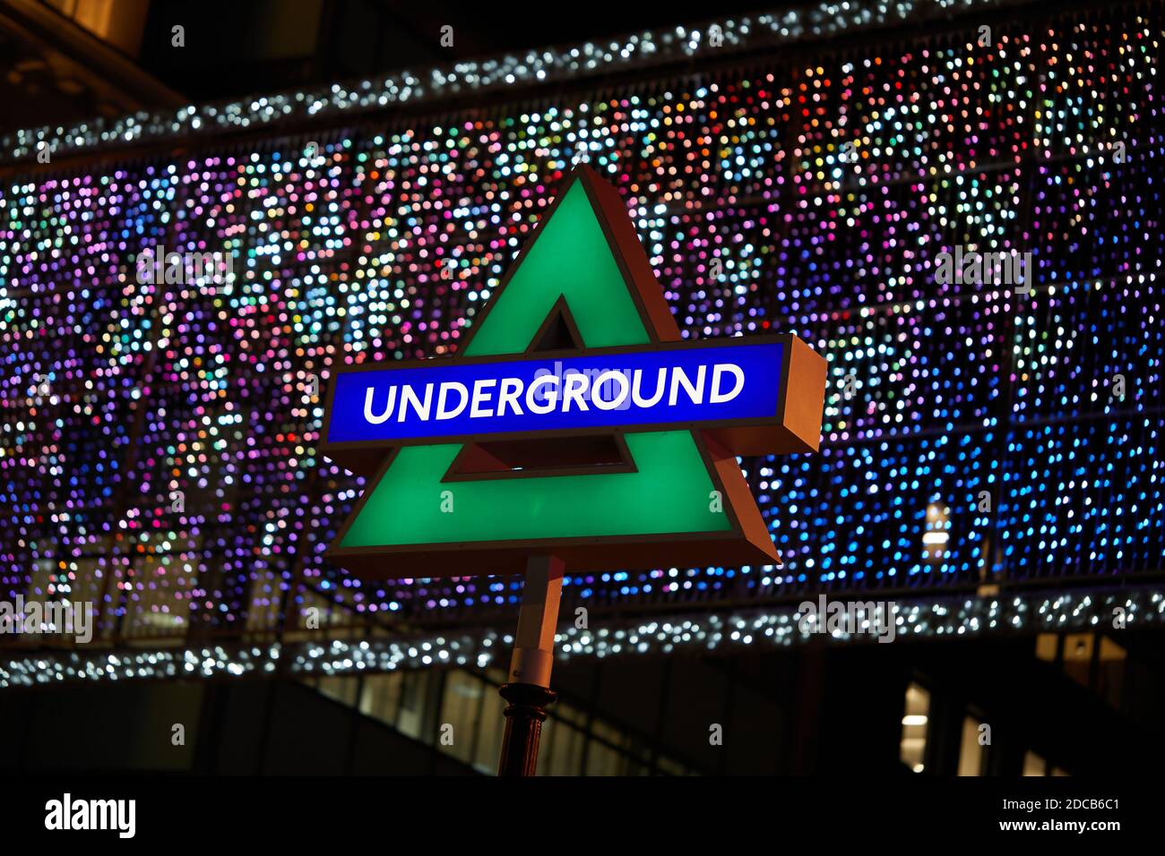 London, UK. - 19 Nov 2020: One of four illuminated PlayStation button symbols installed at Oxford Circus tube stations in a deal between Sony and Transport for London to promote the new launch of the PS5 in the U.K. Stock Photo