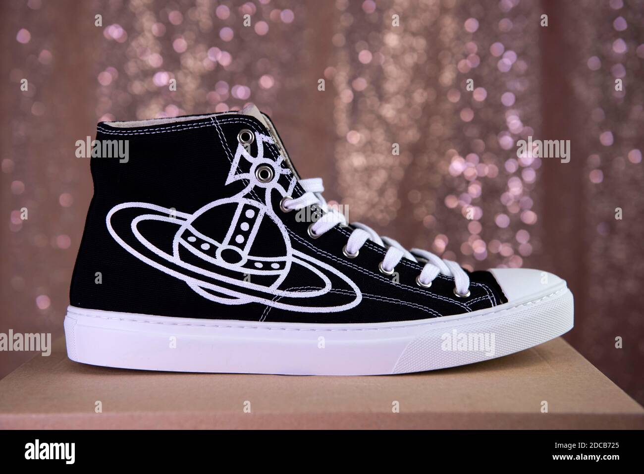 Vivienne Westwood vegan Plimsoll high top trainers with Orb logo design. Stock Photo