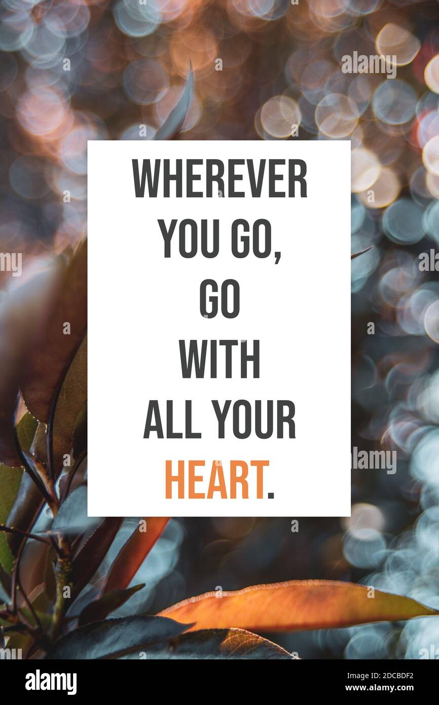 Wherever you go go with all your heart motivational quotes poster Stock Photo
