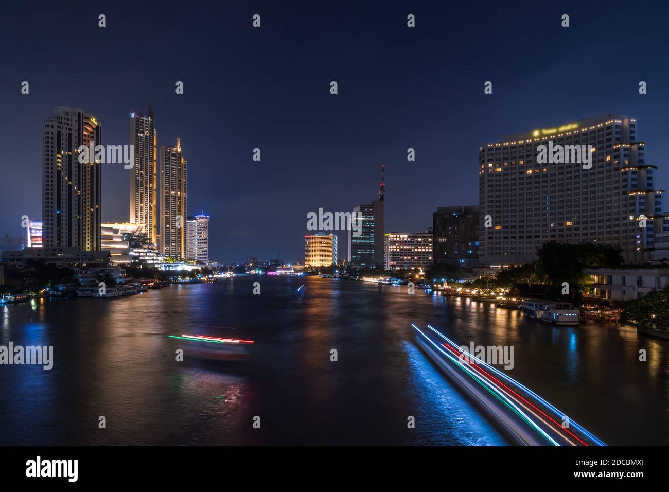 Bangkok city center financial business district, waterfront cityscape and Chao Phraya River during  twilight Stock Photo