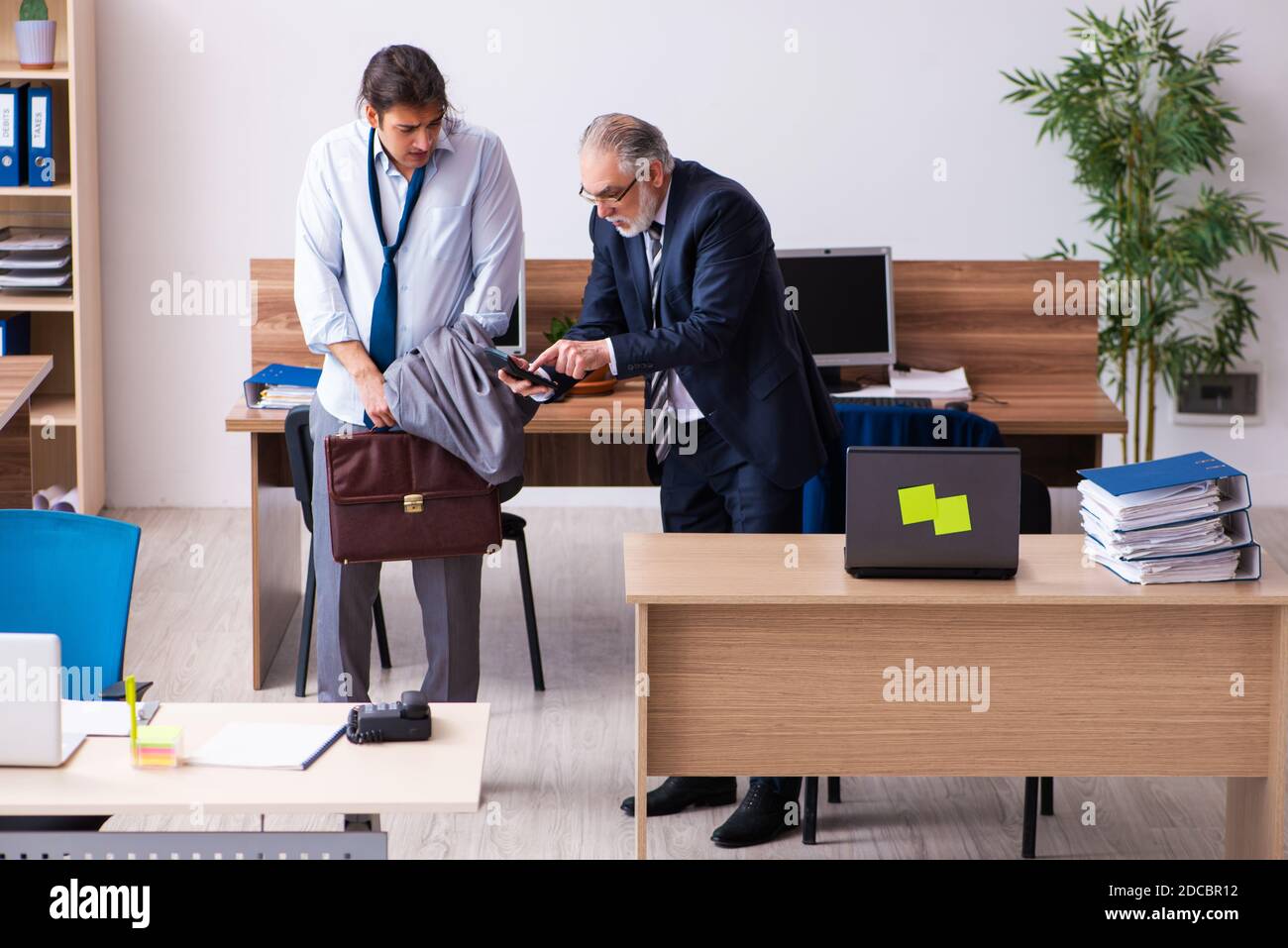 Boss waking up lazy employee hi-res stock photography and images - Alamy