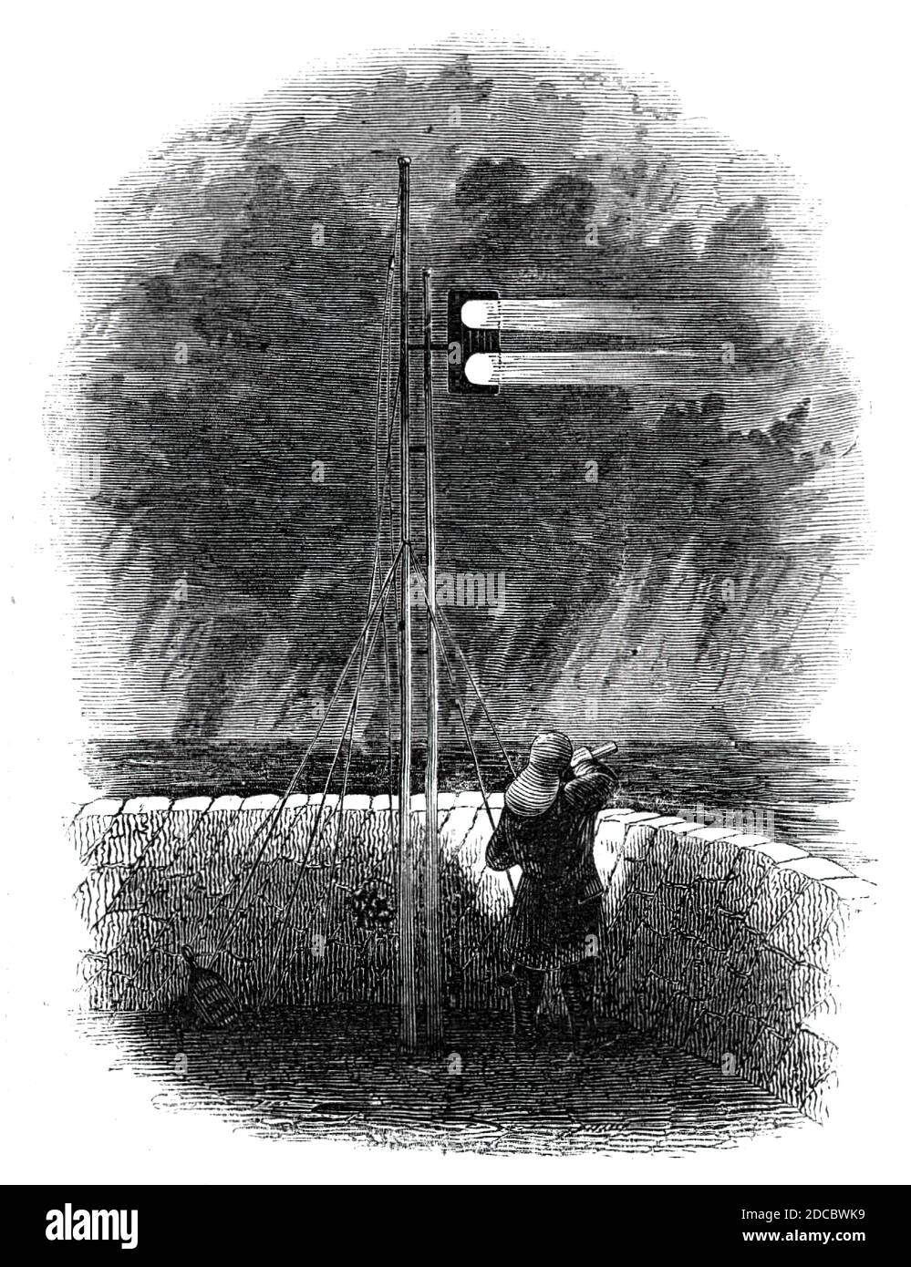 Indian Mail signals, at Folkestone, 1844. Postal service between Britain and India: 'In approaching this port [Folkestone, from Boulogne,] the vessel hoists a signal of the &quot;Mail&quot;...to give notice to the harbour-master and the railroad authorities, to have all things in readiness to speed it on its flight to the metropolis; but if the coast be made during the night, a red light under her bows and a white light at the mast-head are the only signals given. The answer to these signals, from the pierhead, is made by a double white light, as shown in our engraving. The passage by steam ve Stock Photo