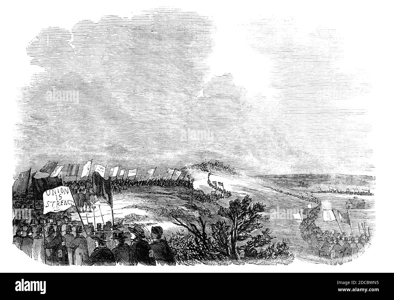 Meeting of pitmen, on Pittington Hill, 1844. Procession of miners in County Durham. 'An unfortunate difference at present exists between the pitmen and the coal owners, as the readers of the &quot;Illustrated London News&quot; will have perceived stated in former columns, which has led to an extensive strike. For some time the men have been making preparations for this movement, by an organised union, embracing the whole body of miners in England, Scotland, and Wales and engaged a solicitor, whom they term their &quot;Attorney-General,&quot; to conduct and advise in their affairs'. From &quot; Stock Photo