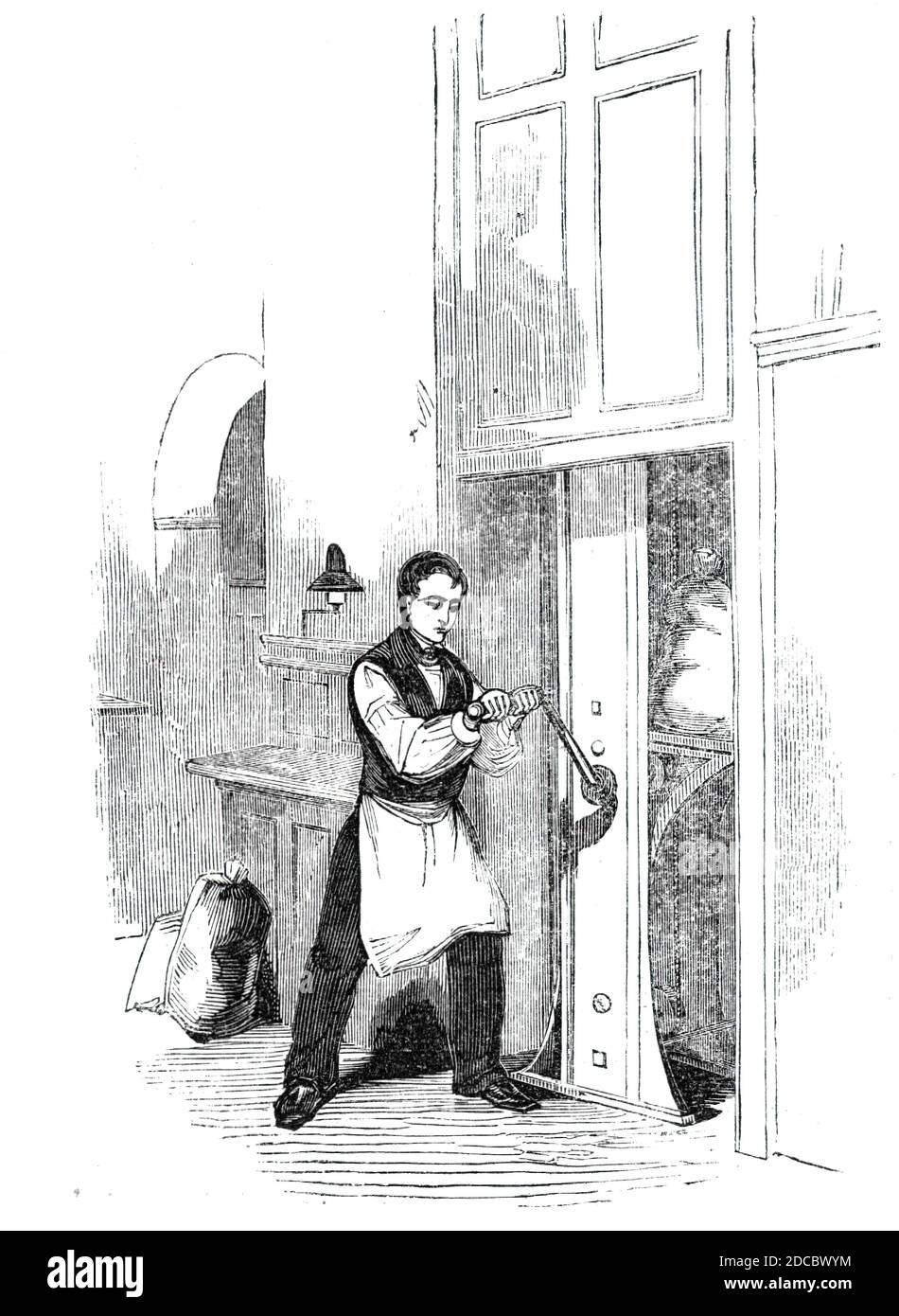 The General Post-Office; Letter-bag hoist, 1844. Worker at the main post office at St Martin's Le Grand in London, using a hoist: 'for raising bags of letters into the Ship Letter-office above'. From &quot;Illustrated London News&quot;, 1844, Vol I. Stock Photo