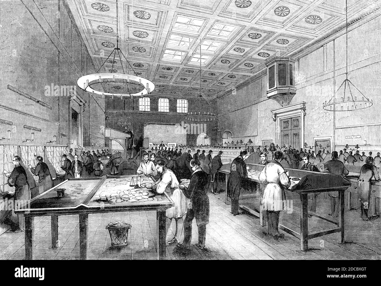 The General Post-Office; The Inland Letter Office, 1844. Workers in the main post office at St Martin's Le Grand in London. 'The inland sorters' room...is well ventilated...in height it is about seventy-eight feet. In the central portion of the roof is an extensive sky-light, which, with three sash-windows near the top of the walls at each end, are the only places where the light of day is admitted. At the southern end of this spacious room is placed a long table, transversely fixed, upon which the letters are thrown as they are from time to time received from the boxes or brought into the off Stock Photo