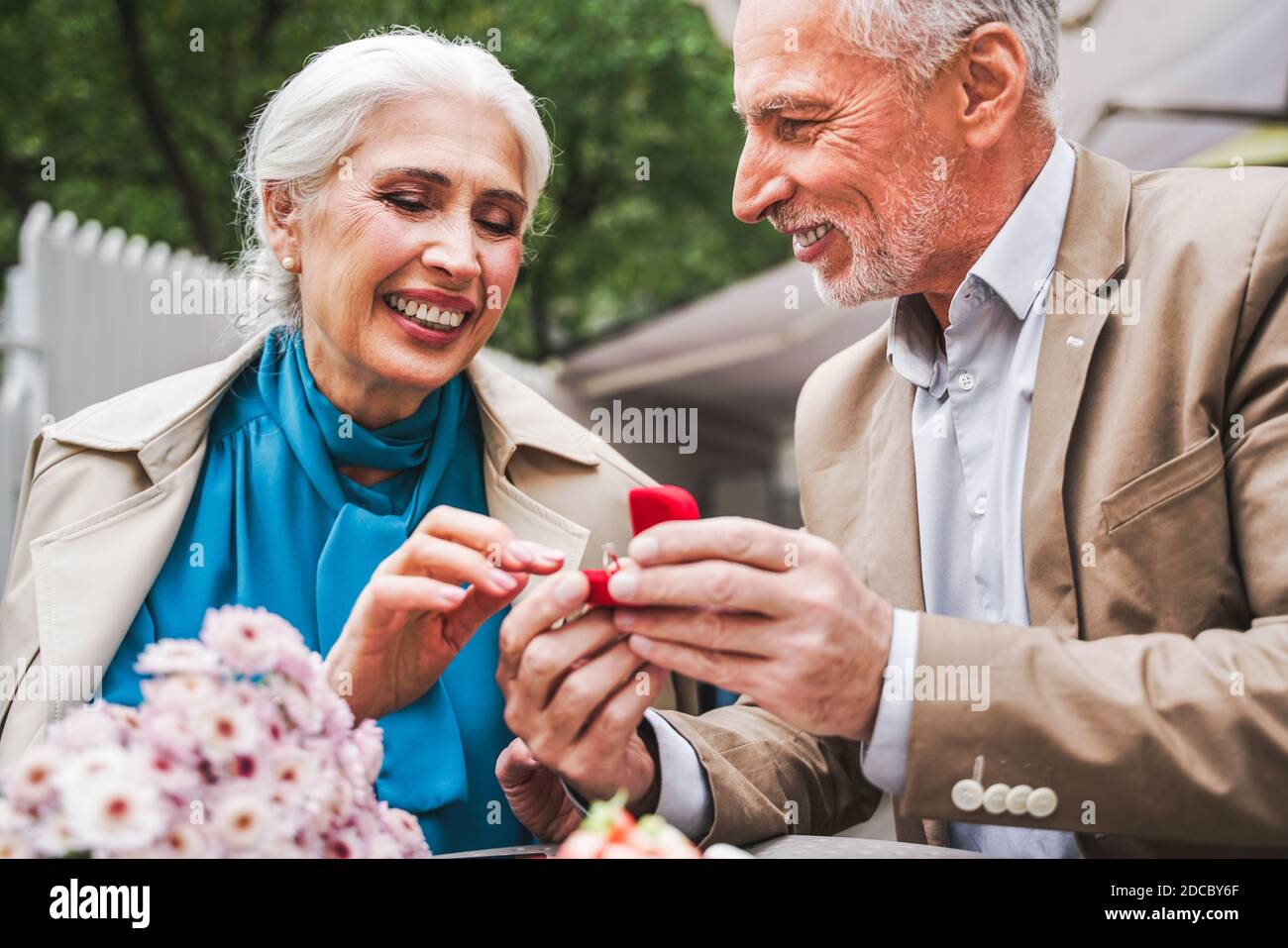 Beautiful senior couple dating outdoors - Mature couple celebrating marrige proposal , concepts about elderly and lifestyle Stock Photo
