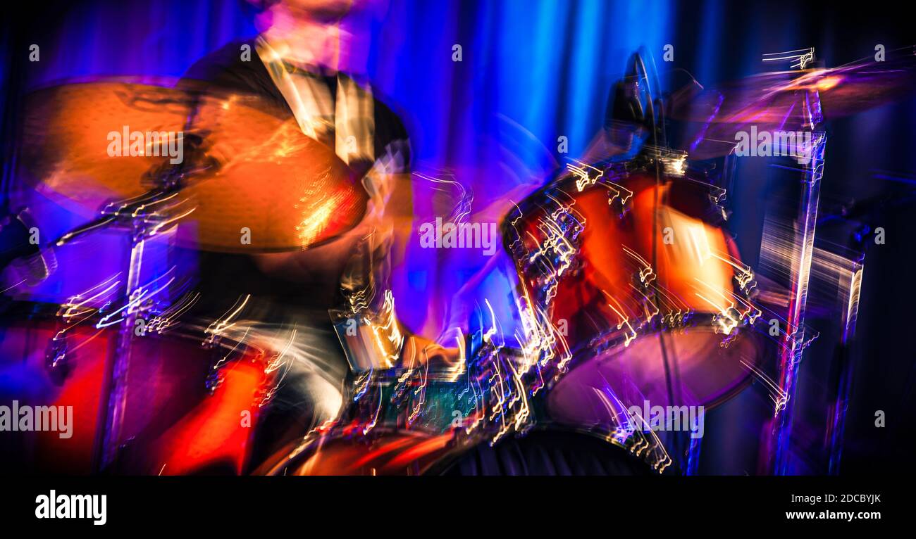 Musician with drums. Abstract image of a drummer at concert. The Sound of Music concept. Intentional motion blur Stock Photo
