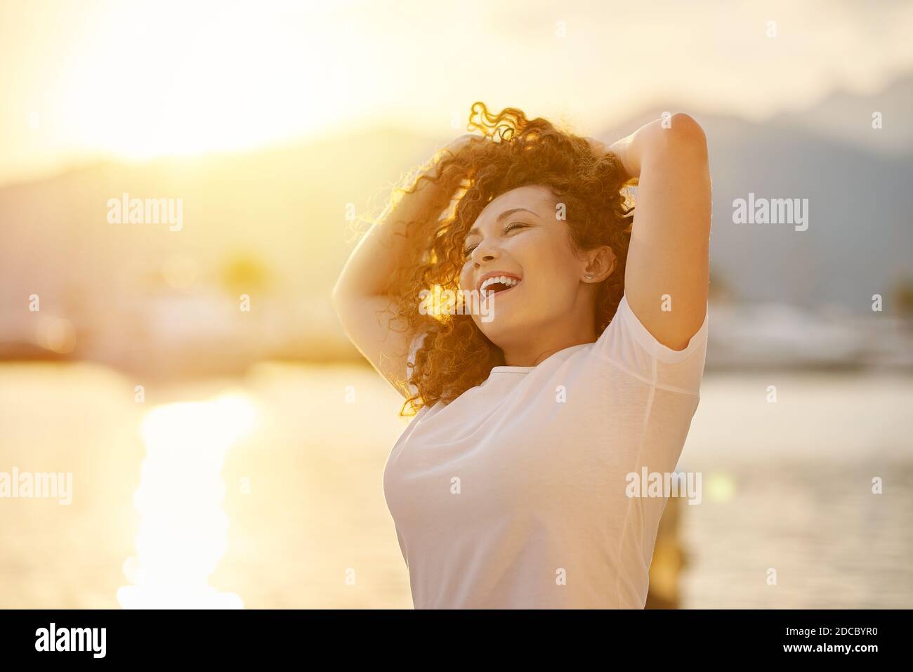 Red head Woman portrait on the beach Stock Photo