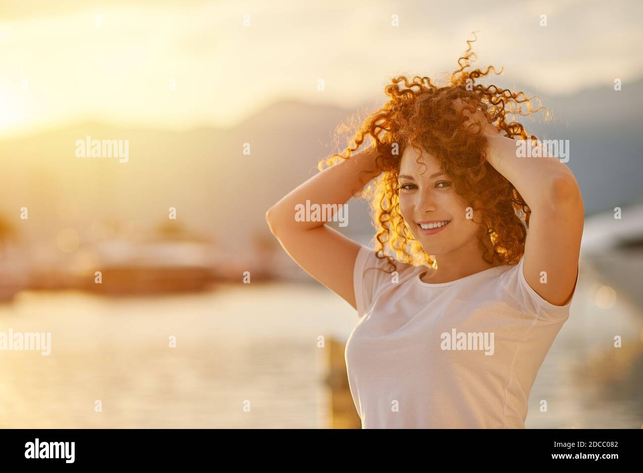 Red head Woman portrait on the beach Stock Photo