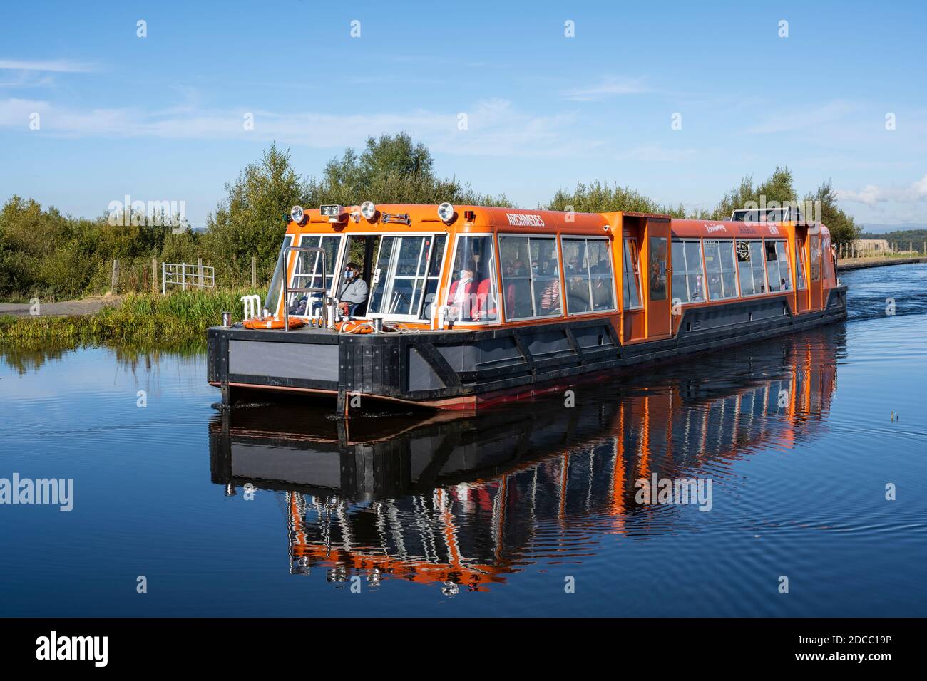 Canal boat on elevated section of canal at top of the Falkirk Wheel rotating boat lift in Falkirk, Scotland, UK Stock Photo