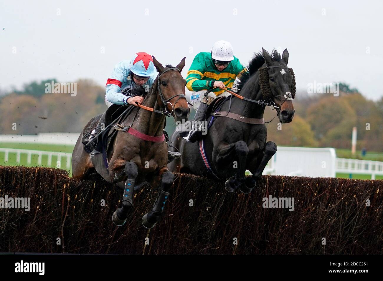 Espoir de Guye ridden by Charlie Deutsch (left) clears the last to win The Coral Handicap Chase at Ascot Racecourse. Stock Photo