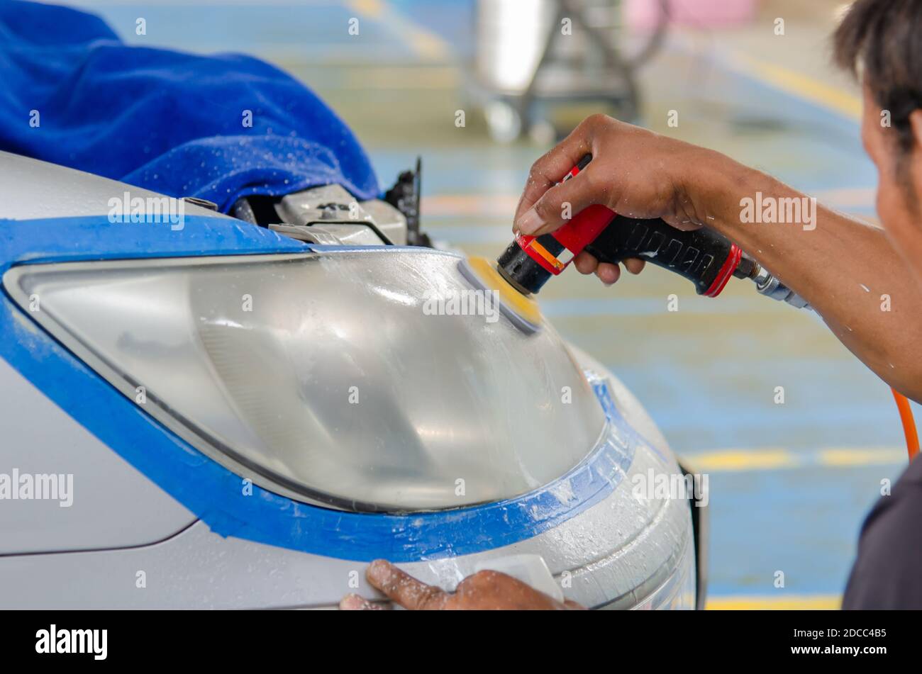Car headlight cleaning polishing machine at car service Stock Photo Alamy