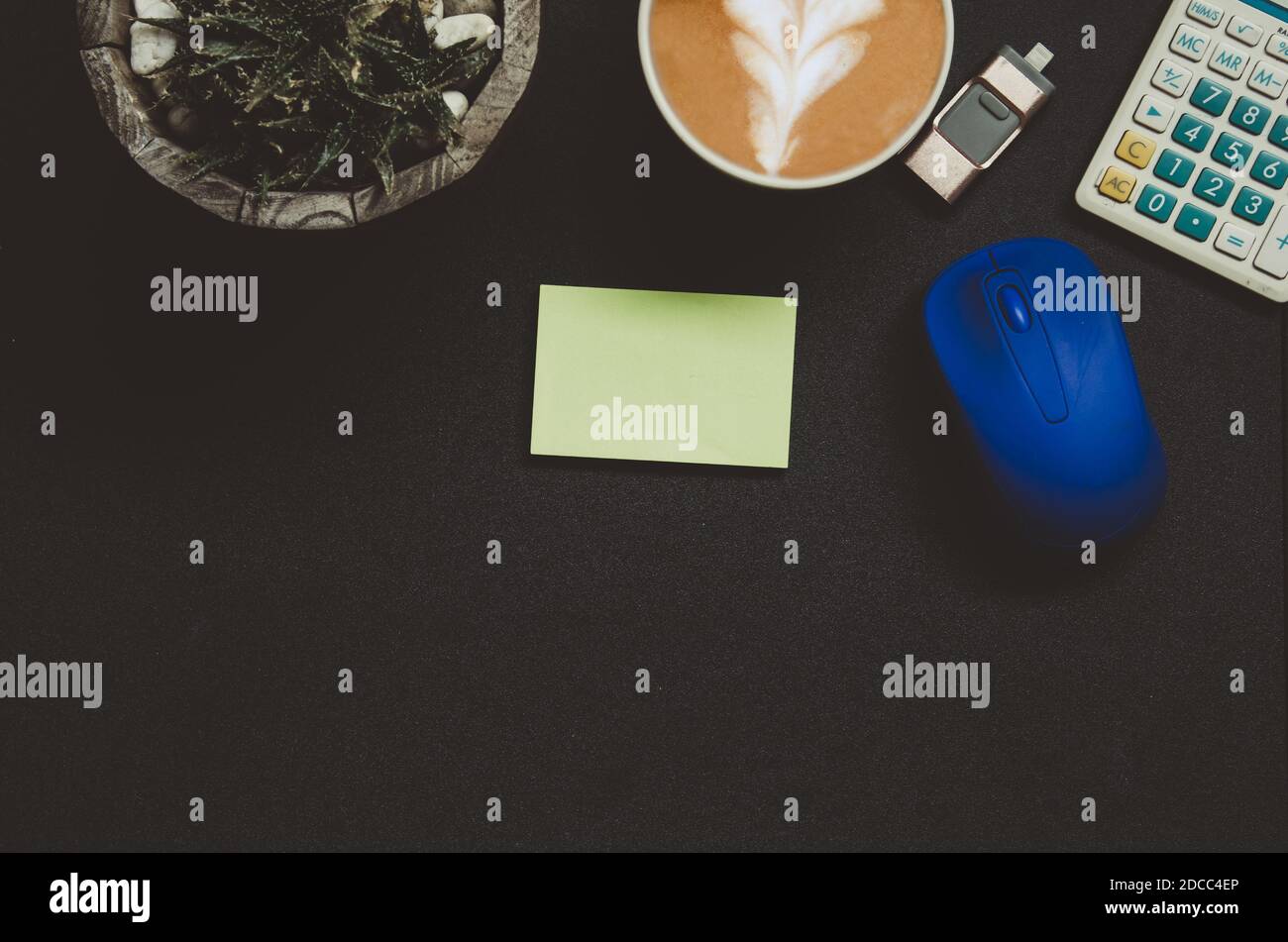 Modern Dark Office Desk Table With Office Supplies Notepad Calculator Coffee Tree Pen And Mouse On Top View And Copy Space Flat Lay Business C Stock Photo Alamy