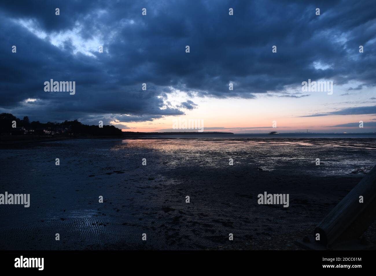 View of Fishbourne from Ryde Seafront, at low tide sundown. Stock Photo