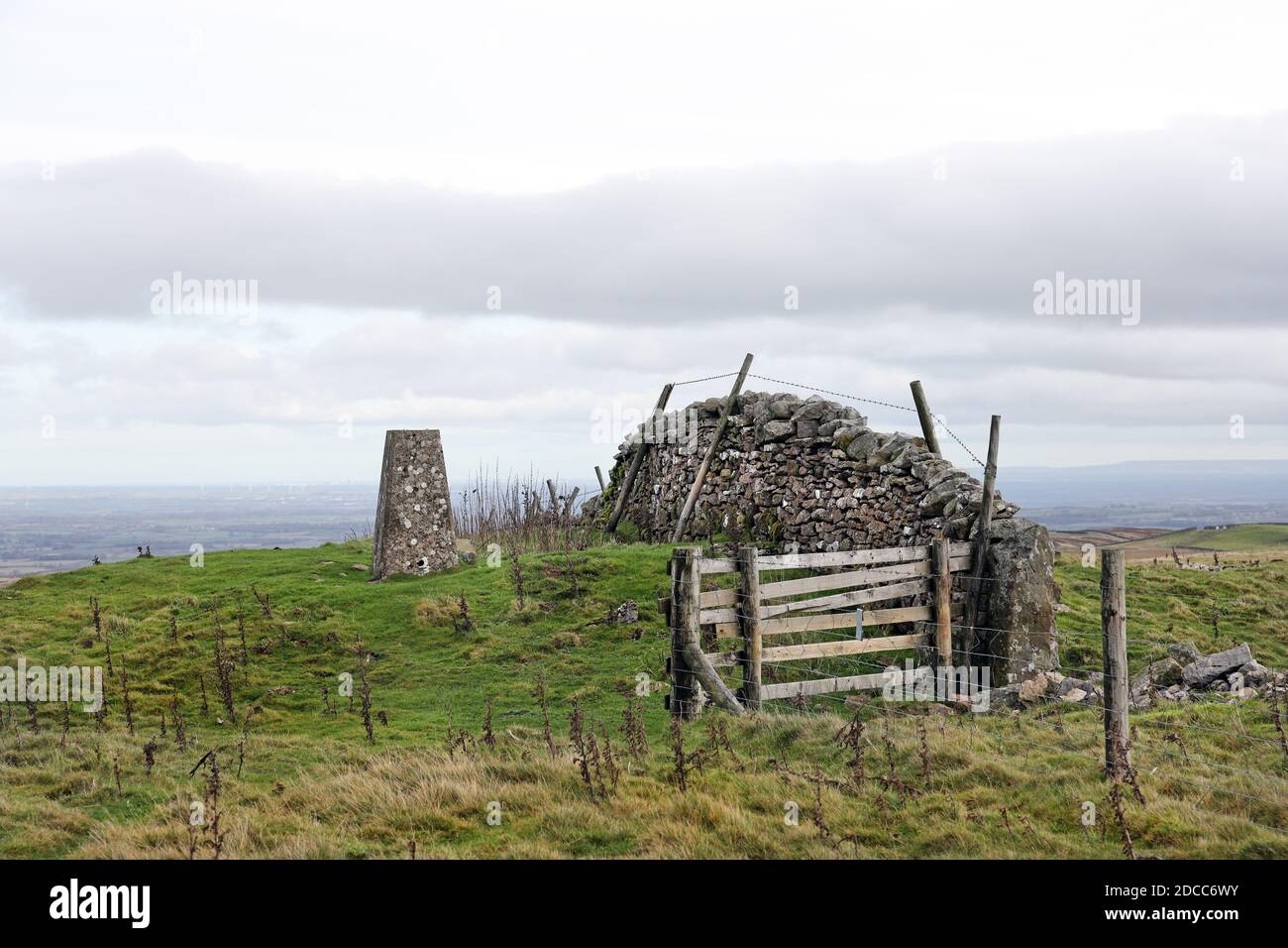 Summit Trig Point on the Ancient Round Barrow of How Tallon, Barningham Moor, Teesdale, County Durham, UK Stock Photo