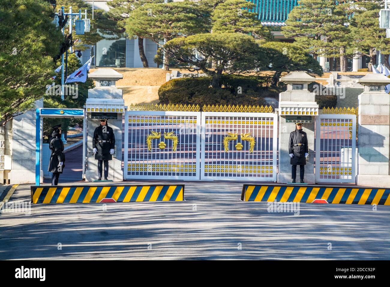 Main gate with security guard on duty at the the Blue House, Chewongde