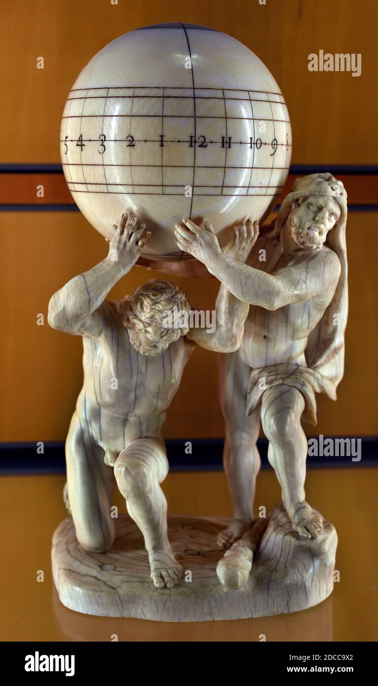 Atlas and Hercules figurine supporting a 17th century ivory sphere France, French. Stock Photo