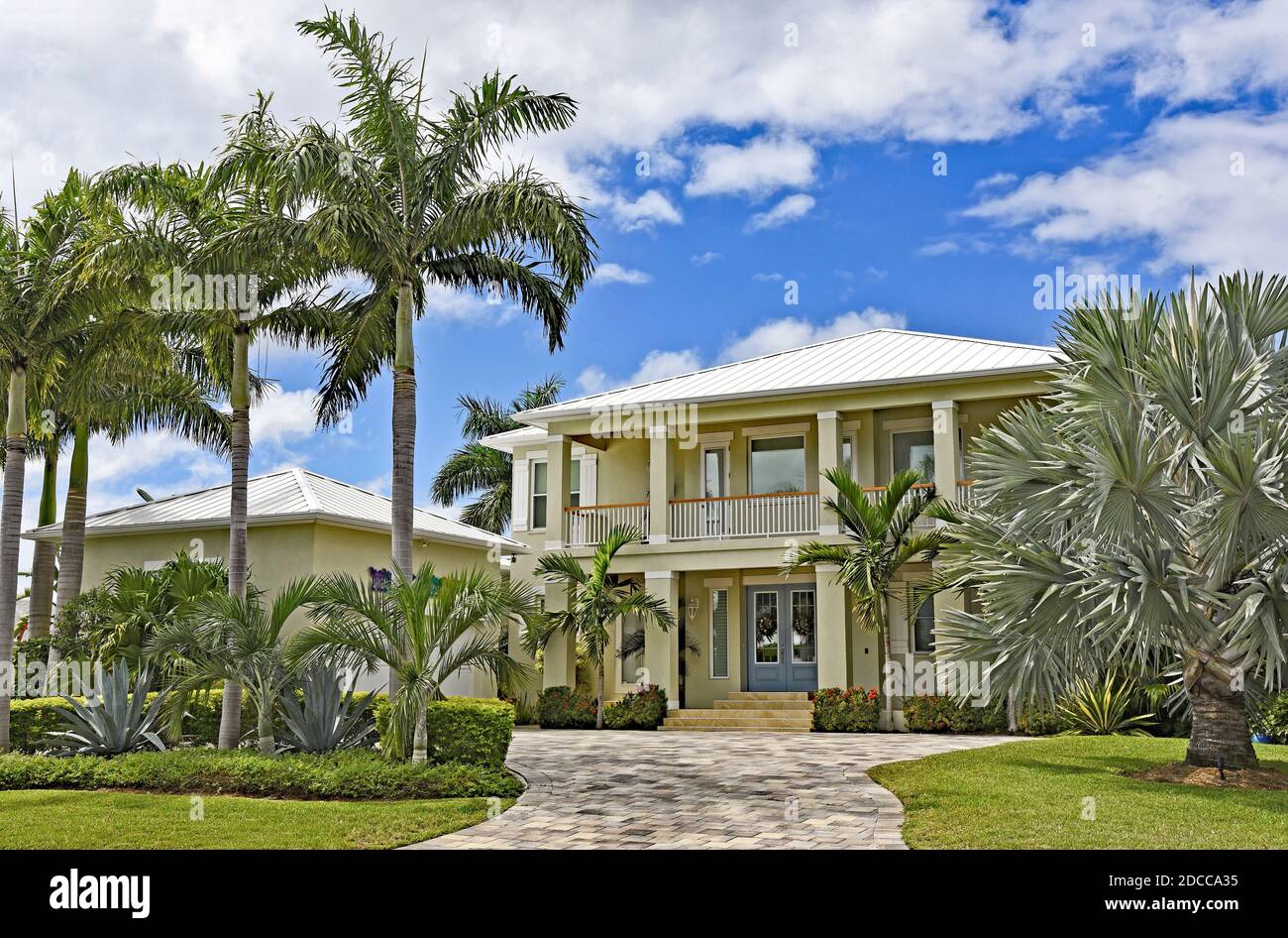 Large New Beach House in Florida with Palm Trees and Landscaping Stock Photo