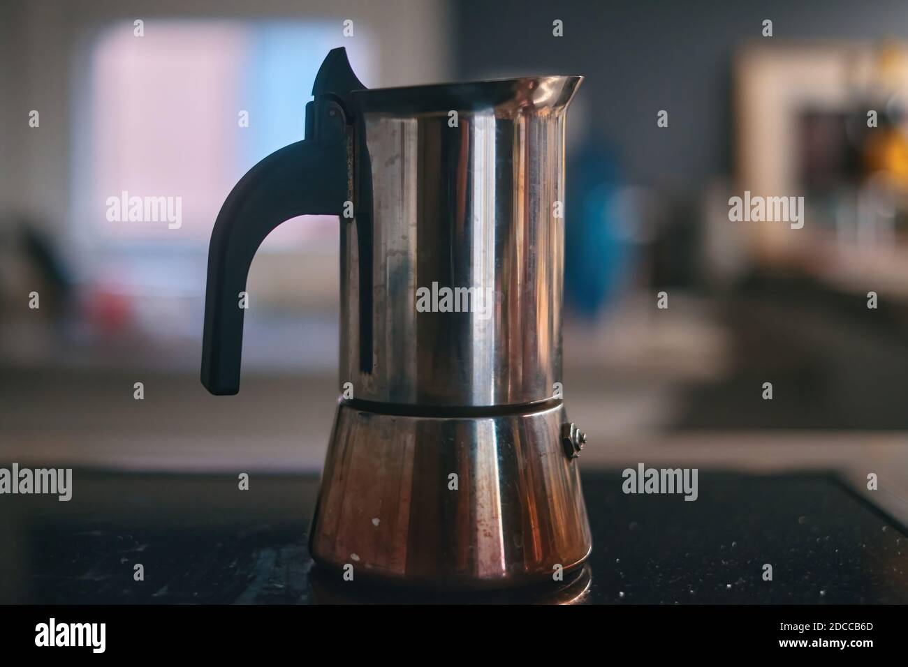 https://c8.alamy.com/comp/2DCCB6D/moka-machine-on-induction-plate-at-morning-in-italy-selected-focus-2DCCB6D.jpg