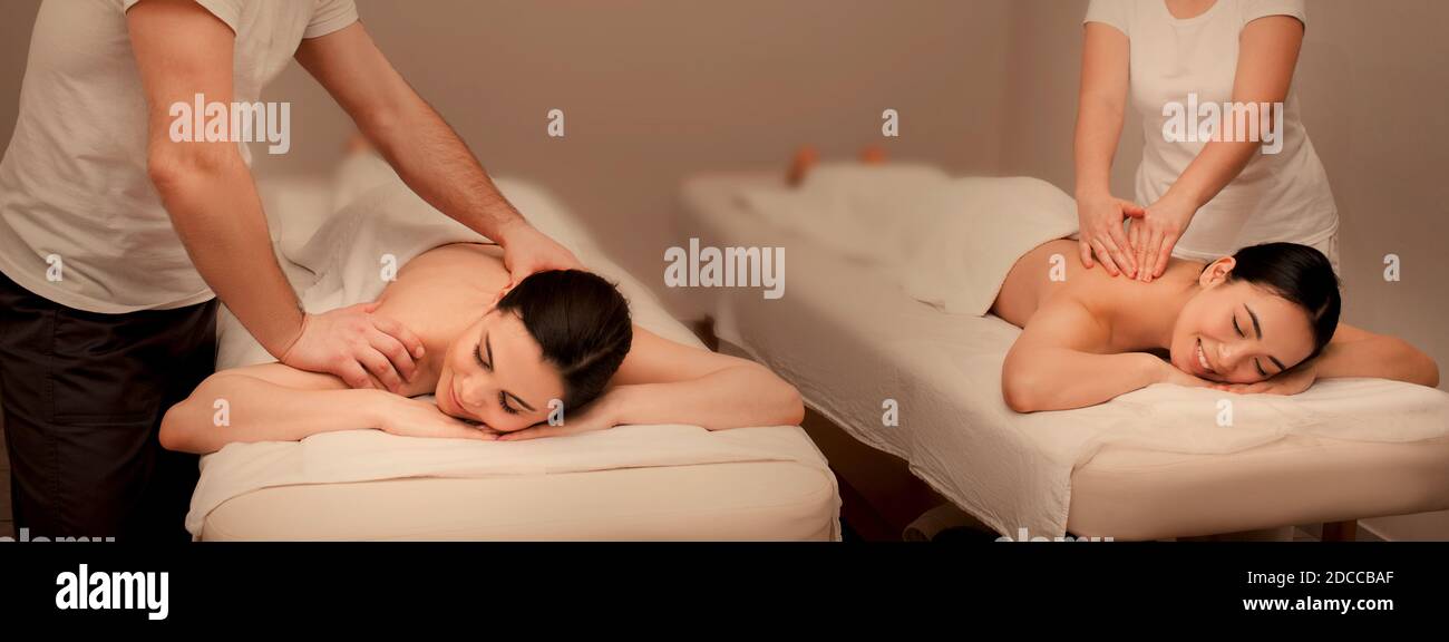 Beautiful asian women getting a classic therapeutic massage at a wellness spa. Relaxing full body massage Stock Photo