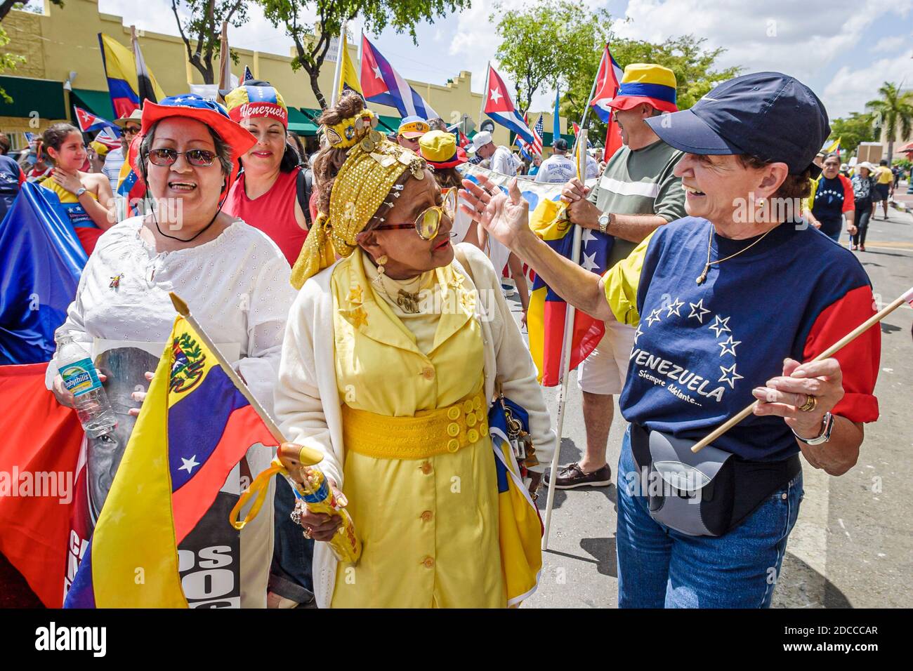 Miami Florida,Little Havana,Hispanic man men,Calle Ocho political protest Fidel Castro Hugo Chavez,signs banners marching Venezuelans Cubans, Stock Photo