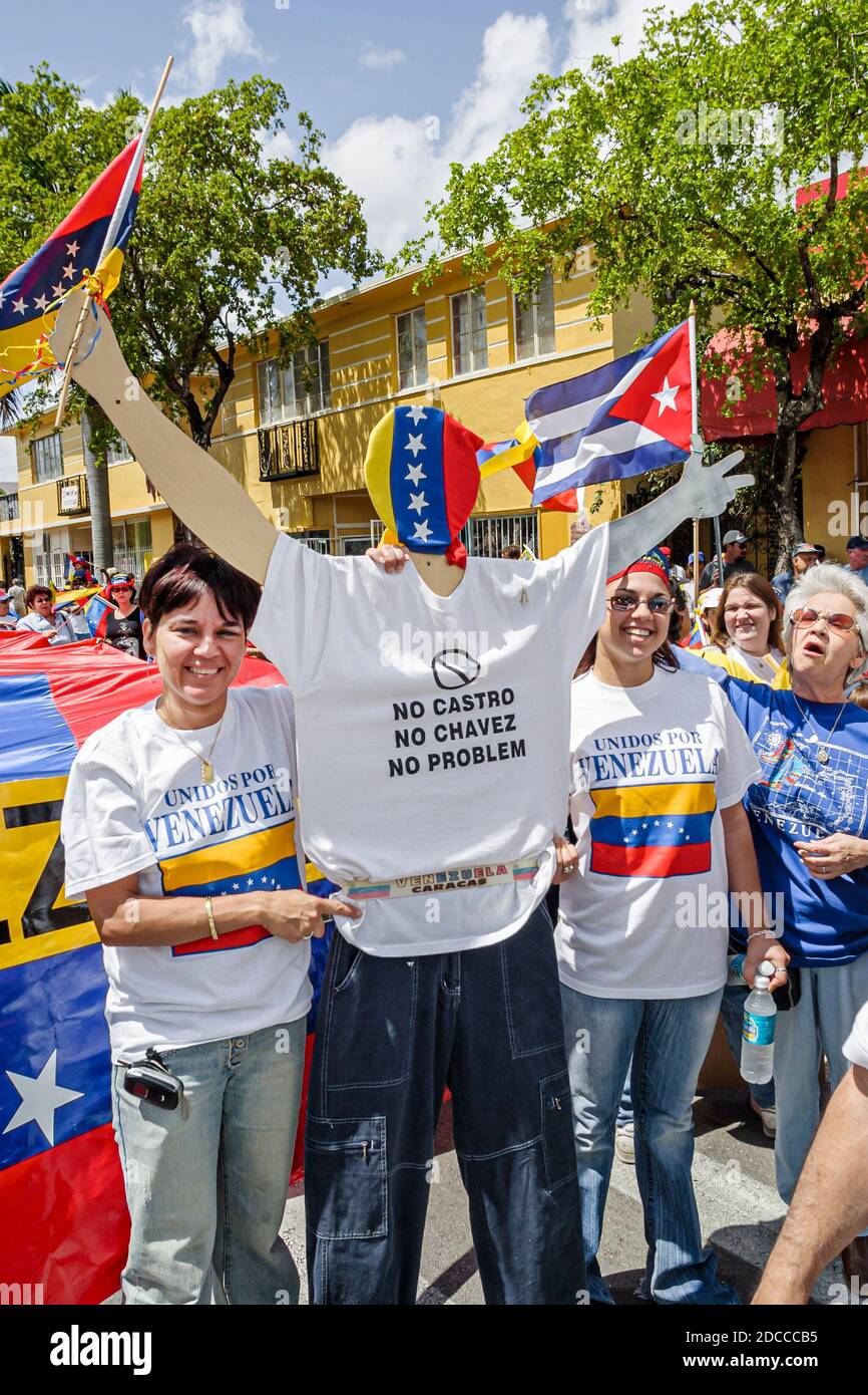 Miami Florida,Little Havana,Hispanic man men,Calle Ocho political protest Fidel Castro Hugo Chavez,signs banners marching Venezuelans Cubans, Stock Photo