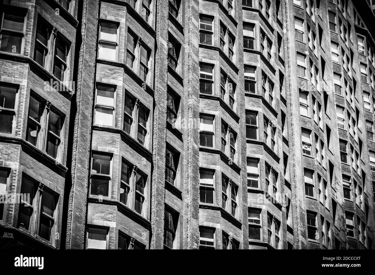 exterior building windows in a row on a historic building in the city Stock Photo