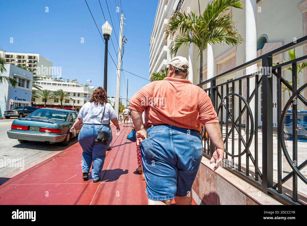 Miami Beach Florida,Ocean Drive,overweight obese obesity fat heavy plump rotund stout,man woman female couple walking, Stock Photo